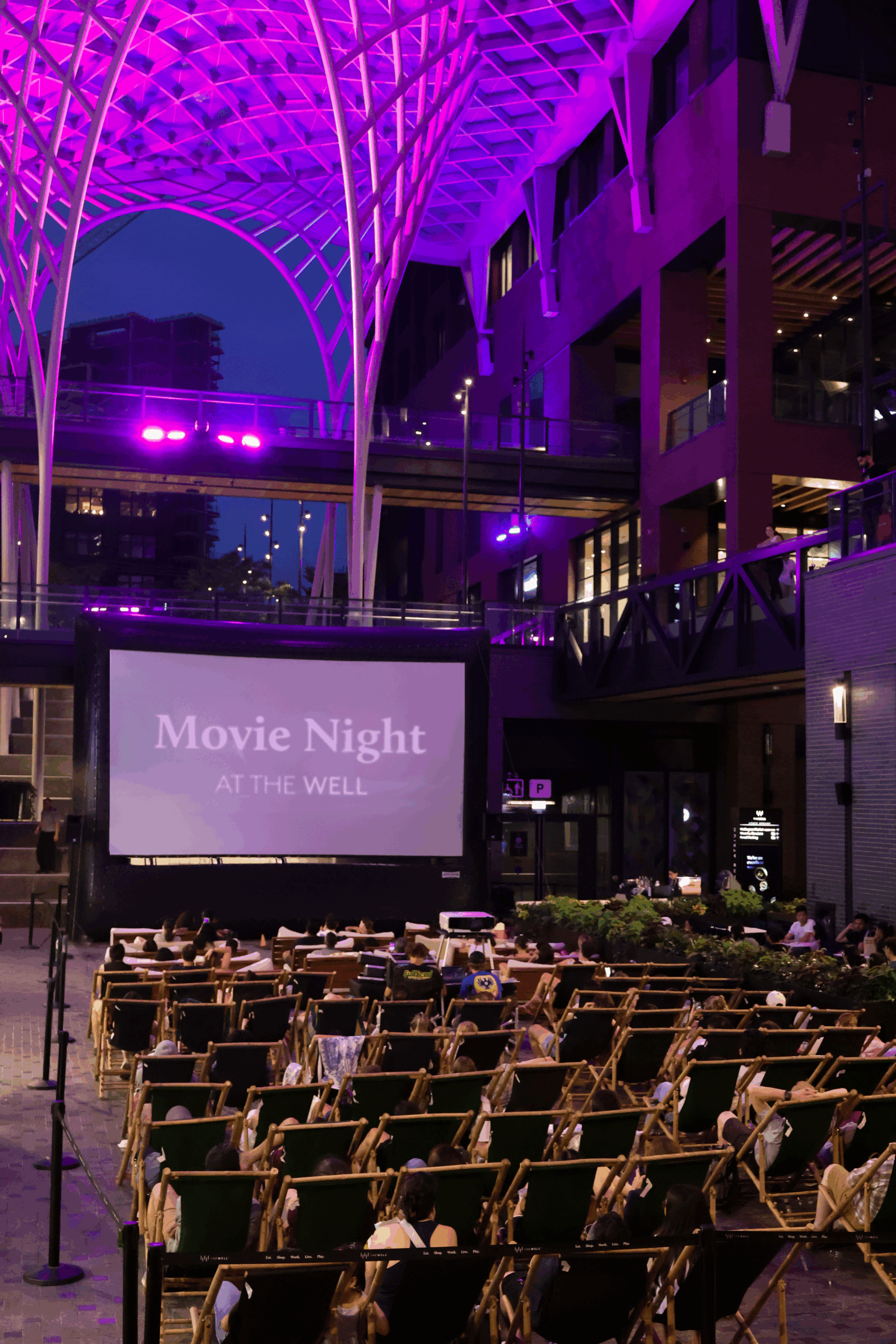 Outdoor Movie Night at The Well Toronto featuring a free screening of The Iron Giant under the glass courtyard.