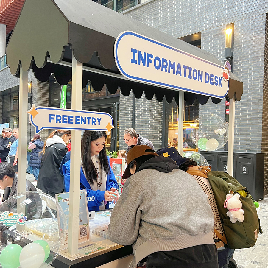 Visitors exploring Surprise Carnival Market 2025 at The Well Toronto, featuring 60+ local artists, handmade crafts, and carnival-inspired pop-ups.