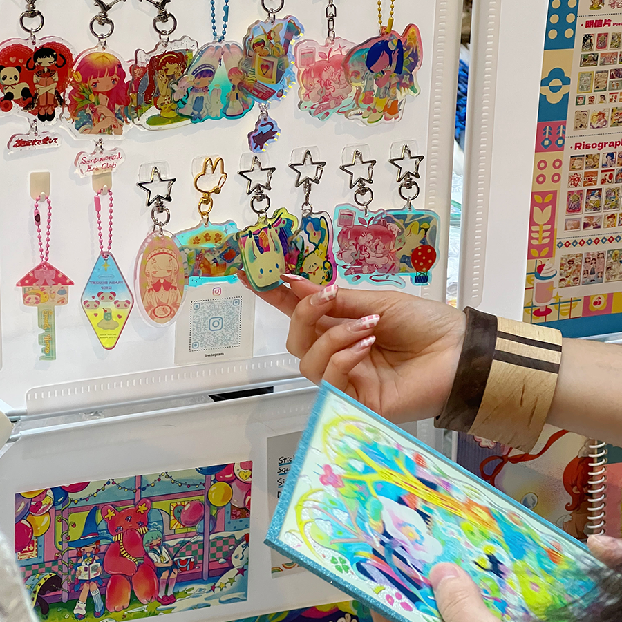 Close-up of colourful handmade keychains and whimsical art charms from local Toronto artists at The Well’s Surprise Carnival Market 2025.
