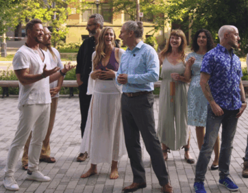 Group of Résone performers at The Well in downtown Toronto, gathered outdoors in a relaxed setting